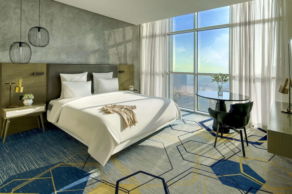 Deluxe Suite, 1 King Bed, Lagoon View | 1 bedroom, minibar, in-room safe, desk