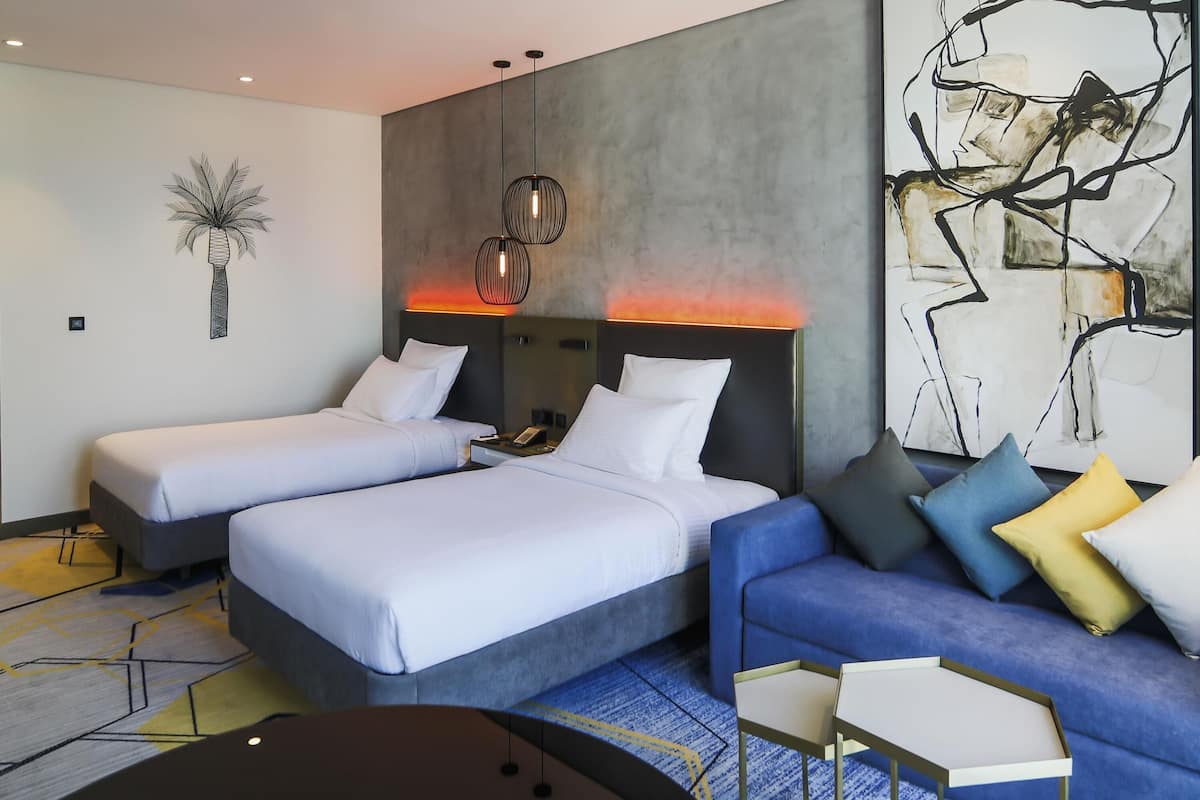 Deluxe Room, 2 Twin Beds, Lagoon View | Minibar, in-room safe, desk, laptop workspace