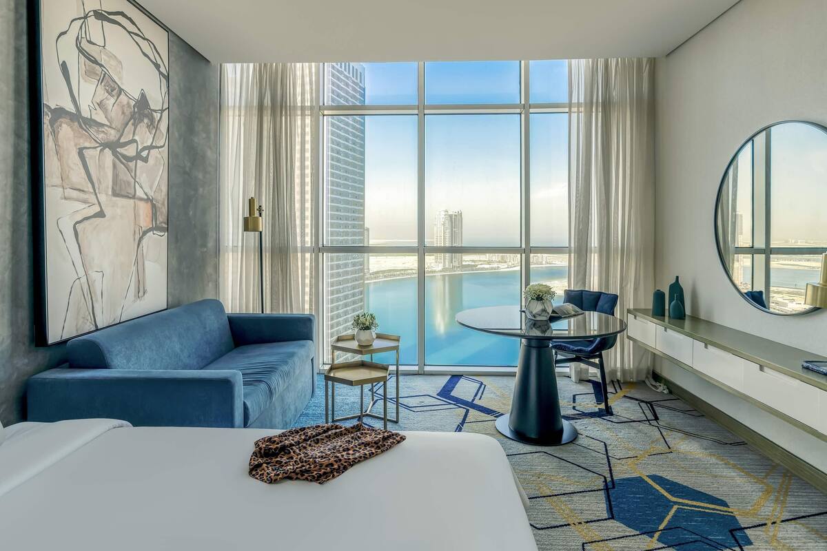 deluxe room, 2 single beds, lagoon view | 1 bedroom, minibar, in-room safe, desk