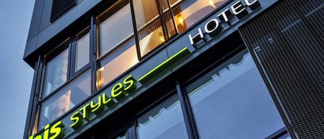 A hotel sign with 'ibis styles' and 'HOTEL' written on it.