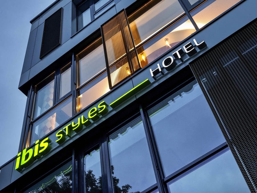 A hotel sign with 'ibis styles' and 'HOTEL' written on it.