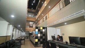 A modern office space with a mezzanine level, multiple workstations, and a reception area. - VITS Select Kudro Destinn (Mangaluru)
