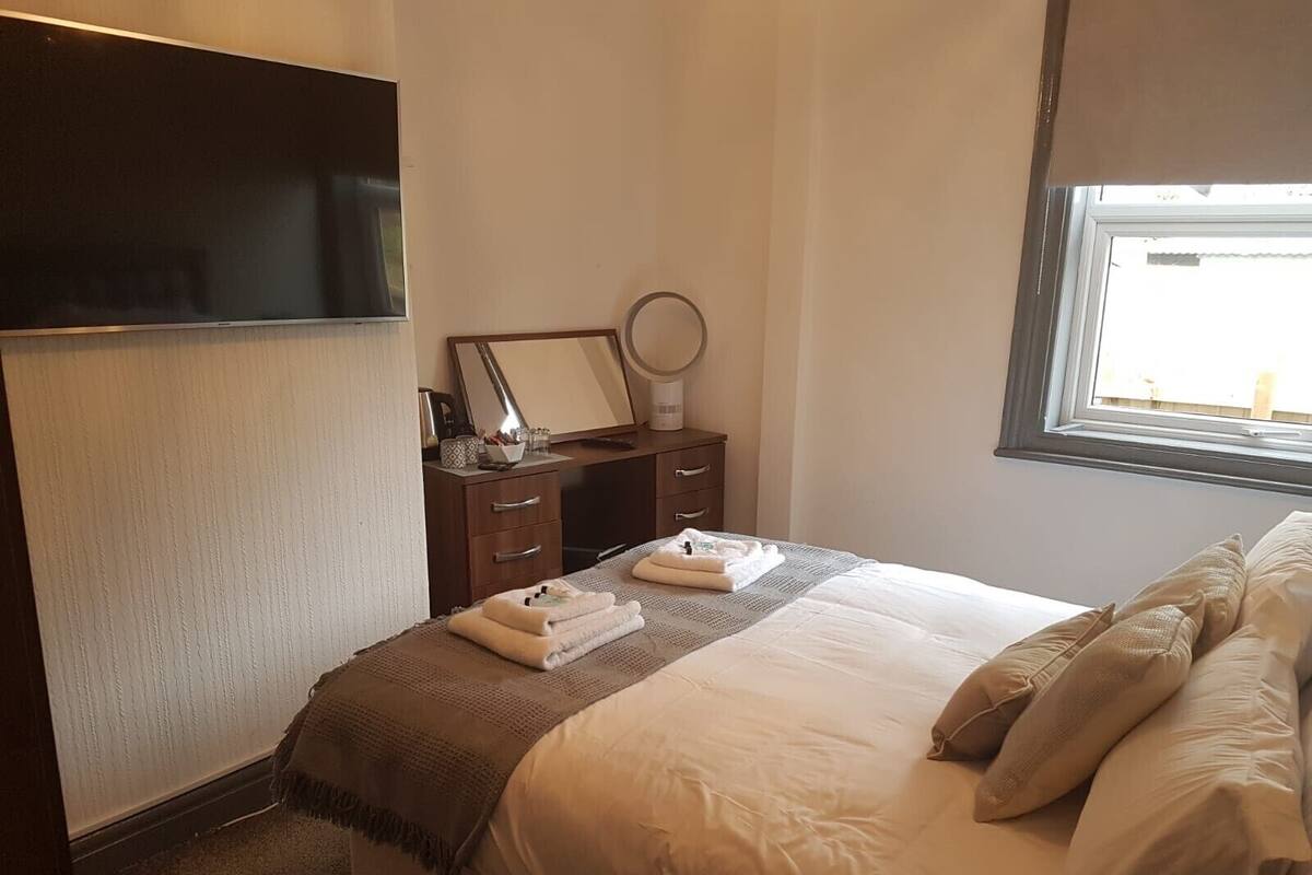 Desk, iron/ironing board, cribs (free), WiFi (free)