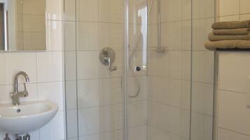 Double Room, Balcony | Bathroom | Shower, hair dryer, towels