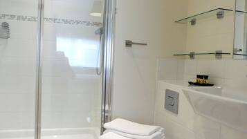 Combined shower/bathtub, hair dryer, towels, soap