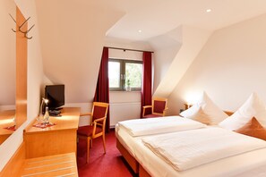 Hypo-allergenic bedding, desk, laptop workspace, blackout curtains