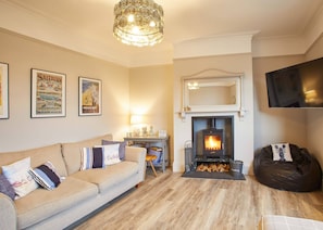 Three-Bedroom House | Living room | Flat-screen TV, fireplace - Beachcomber House (Redcar)
