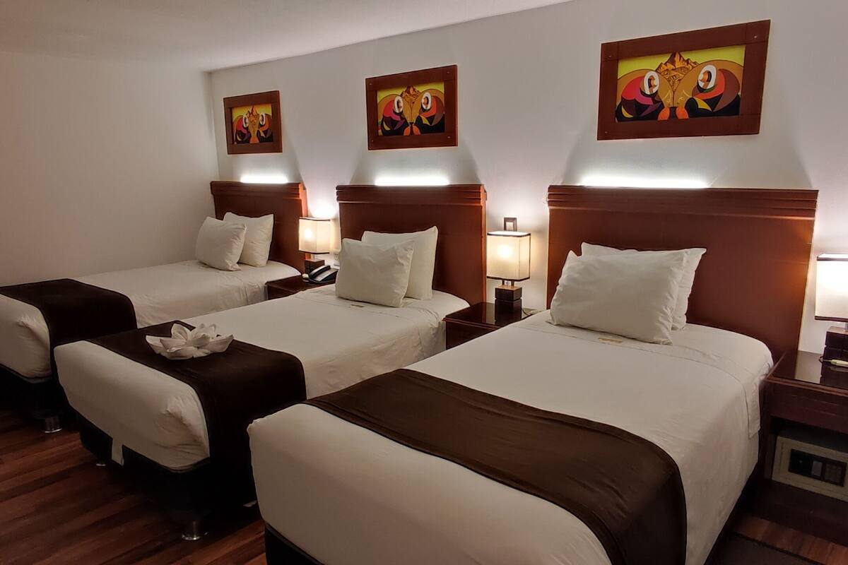 economy triple room | premium bedding, minibar, in-room safe, individually decorated