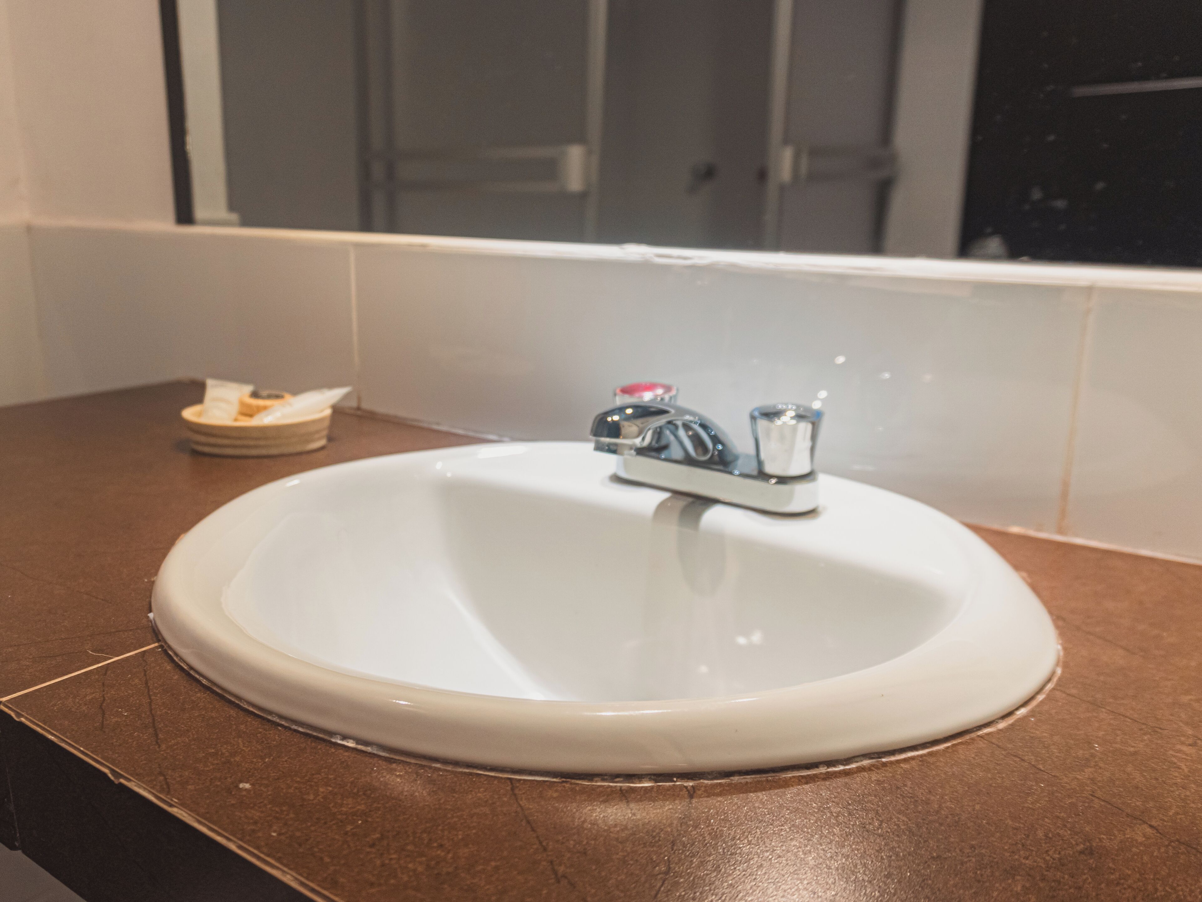 economy twin room | bathroom | shower, hair dryer, towels, soap