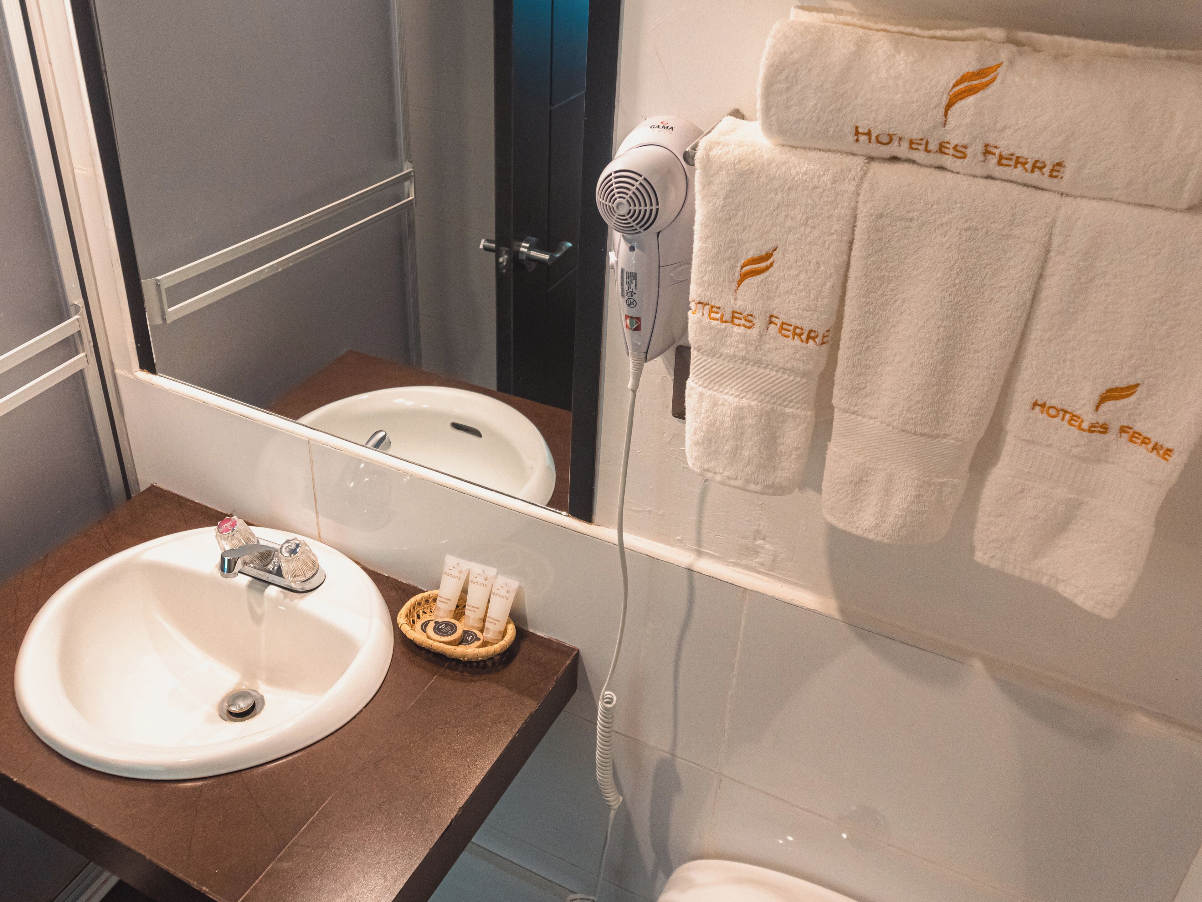standard twin room | bathroom | shower, hair dryer, towels, soap