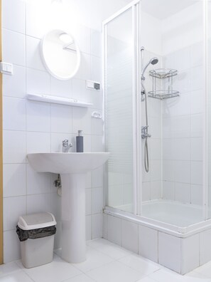 Basic Condo | Bathroom | Hair dryer, towels, toilet paper