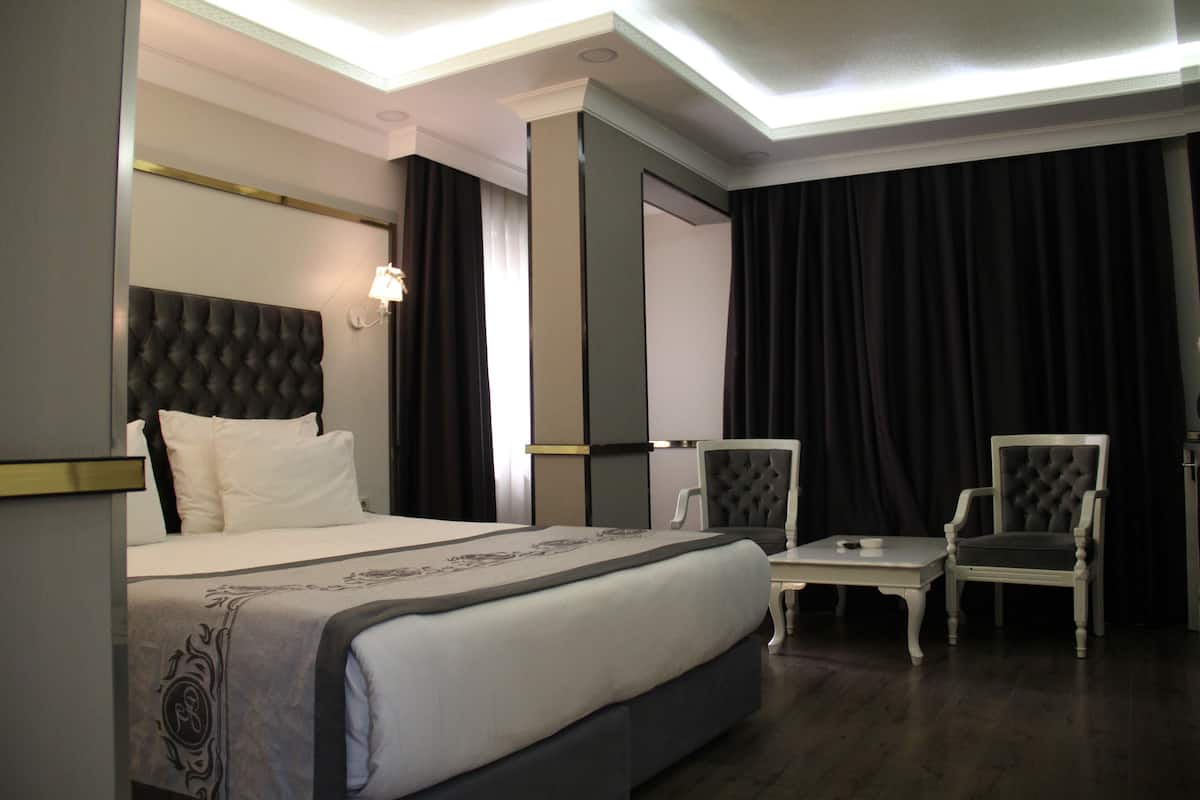 Suite junior | 1 habitación, ropa de cama de alta calidad y minibar