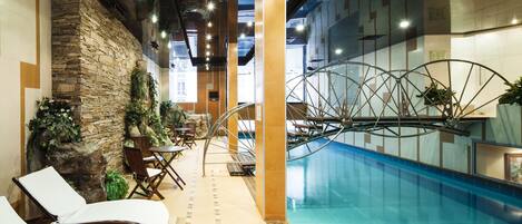 Indoor pool, open 9:00 AM to 9:00 PM, pool loungers
