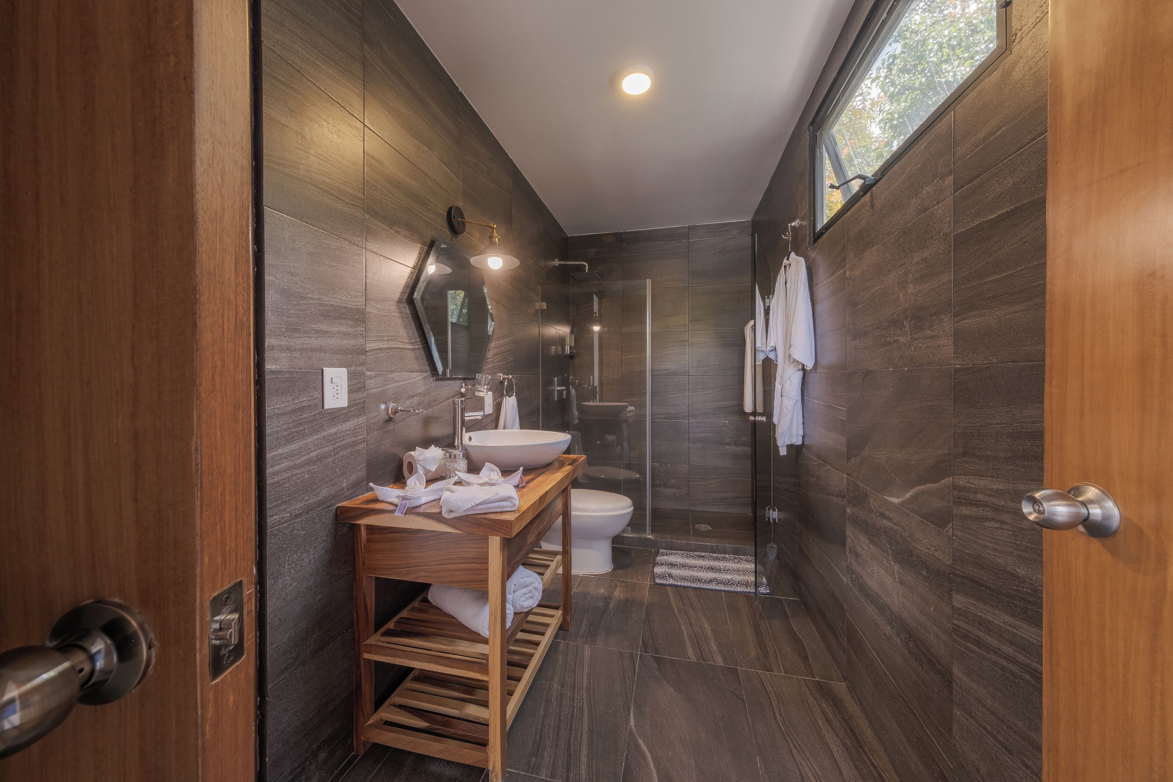 rainfall showerhead, hair dryer, bathrobes, towels