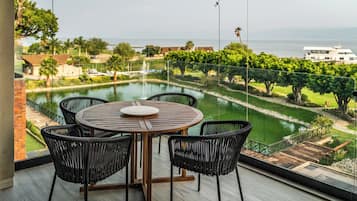 Luxury Studio Suite | Living area | 55-inch Smart TV with digital channels, Netflix, streaming services