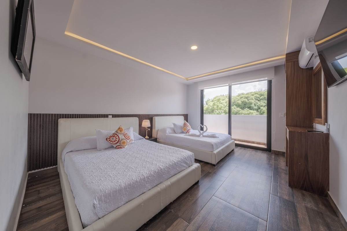 Deluxe Double Room, 2 Bedrooms | In-room safe, blackout curtains, iron/ironing board, free WiFi