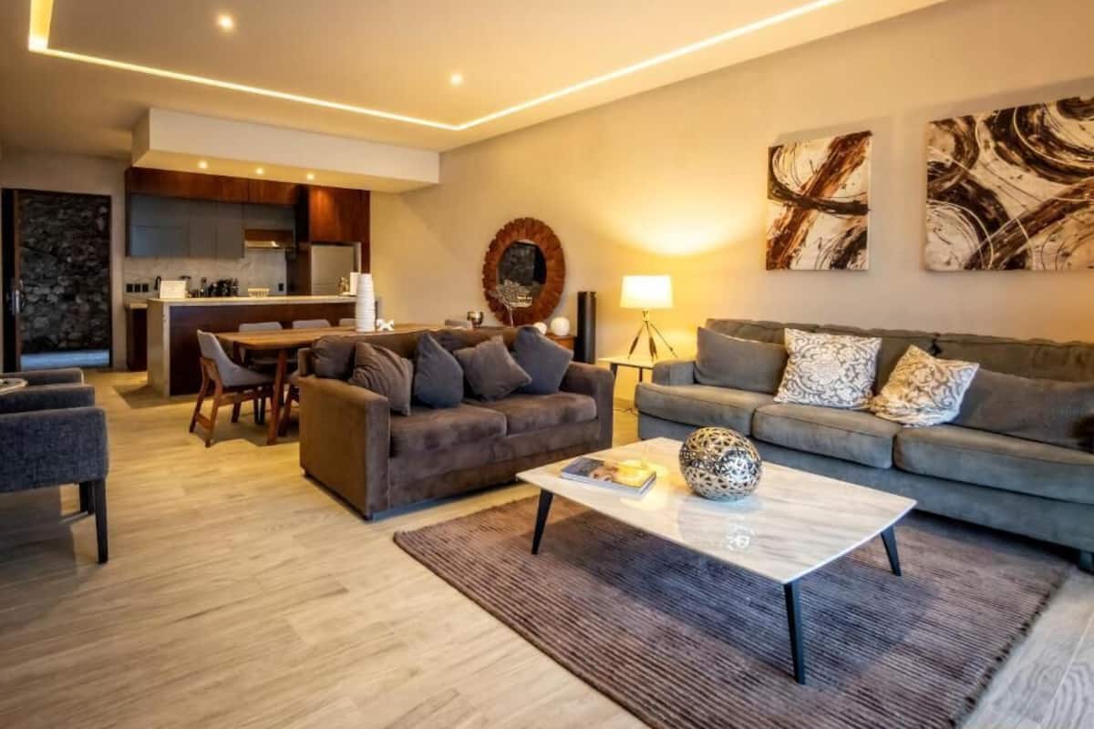 Deluxe Quadruple Room, 2 Bedrooms, Lake View | Living area