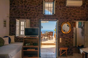 Traditional Apartment, 1 Bedroom, Sea View (Adam & Eve) | Living area | 30-inch flat-screen TV with satellite channels, Smart TV, Netflix - Santorini Folia Bianca (Santorini)