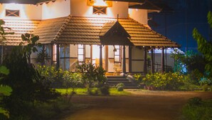 A two-story building with a tiled roof and a porch area. - Rasa Gurukul (Chalakudy)