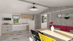 Una cocina moderna con zona de comedor, que incluye una mesa de madera, sillas y un banco rojo.