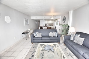 Relax in this stylish living room with a sofa, coffee table, and patterned rug.