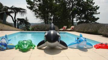Seasonal outdoor pool, open 9:00 AM to 9:00 PM, pool umbrellas