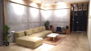 3 BHK Luxury Serviced Apartment | Living room | Flat-screen TV