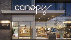 The exterior of a modern building with a large illuminated sign reading "canopy." - Canopy by Hilton Baltimore Harbor Point (Baltimore)