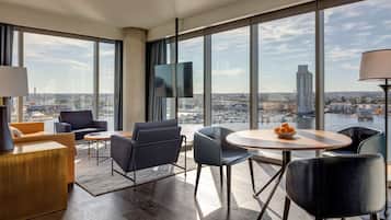Suite, 1 King Bed | Living area | 55-inch LCD TV with satellite channels, TV, Netflix