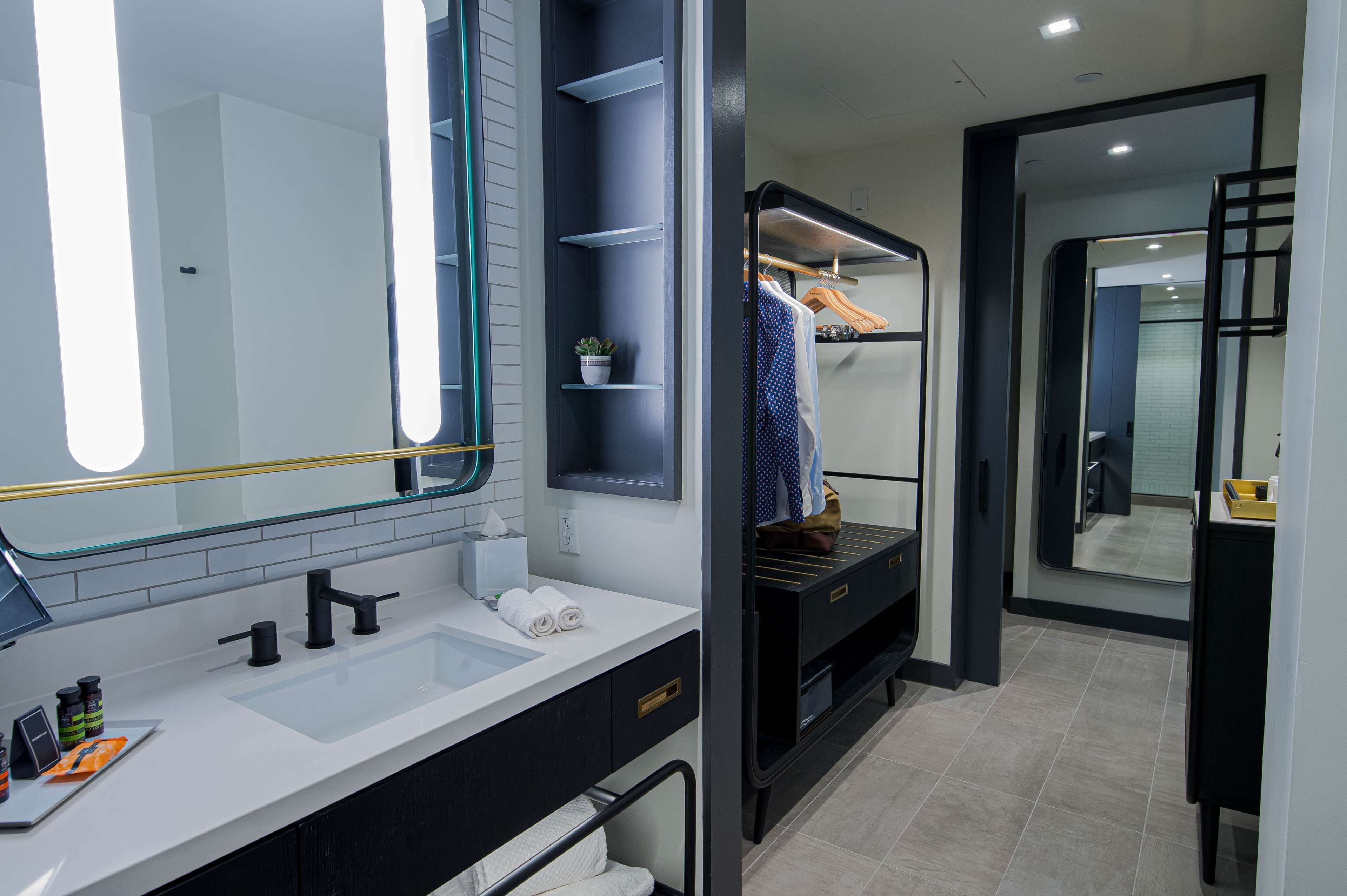 deep-soaking bathtub, hydromassage showerhead, designer toiletries