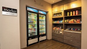 A small market area with refrigerated beverage dispensers and shelves stocked with snacks and beverages. - Residence Inn by Marriott Nashville Mt. Juliet (Mount Juliet)