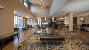 A spacious lobby with a large seating area, a bar, and a television screen. - Residence Inn by Marriott Nashville Mt. Juliet (Mount Juliet)