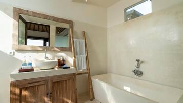 Combined shower/tub, hair dryer, towels, soap