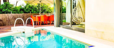 This is the beautiful terrace, where there is a modern pool, which is great for cooling off when it gets too warm.