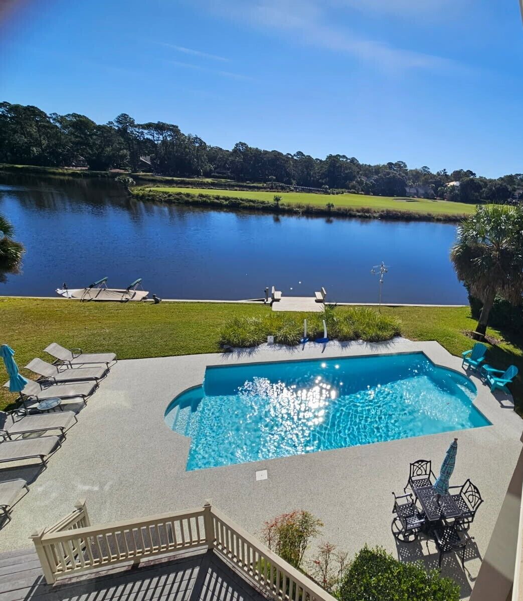 Backyard with new pool surround (Oct. 2025) and pool resurfaced (Feb. 2025)