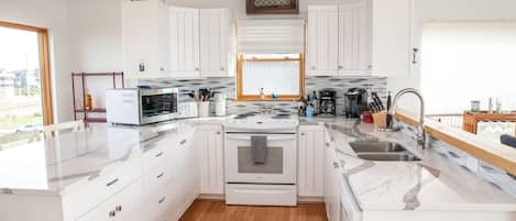 Cottage, 4 Bedrooms | Private kitchen | Fridge, coffee/tea maker