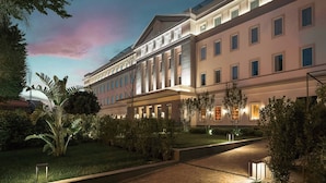 A multi-story hotel with a symmetrical facade, large windows, and a well-maintained garden. - HABITA79, Pompeii, a Tribute Portfolio Hotel (Pompei)