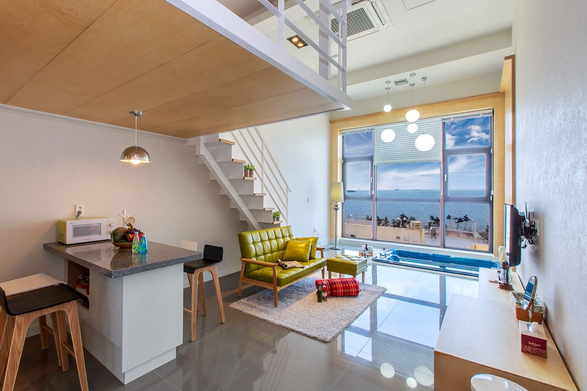 Duplex, Jetted Tub (301) | Living area | LED TV