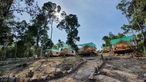 A campsite with multiple elevated wooden structures, each with a green roof and a small porch. - 4k Camp Koh Rong (Koh Rong)