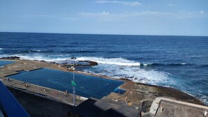 A coastal swimming area with a large pool, rocky shoreline, and a clear view of the ocean. - Bajamar, a magical place. (Bajamar)