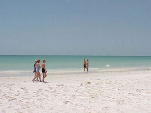 A beach with people walking on the sand. - SHORT WALK TO VILLAGE, BEACH - HEATED POOL - LUSH LANDSCAPING
2 SEPARATE UNITS. (Siesta Key)