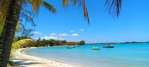 On the beach, sun loungers, beach towels