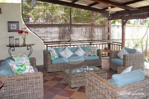 Sitting area under verandah. Ceiling fan.