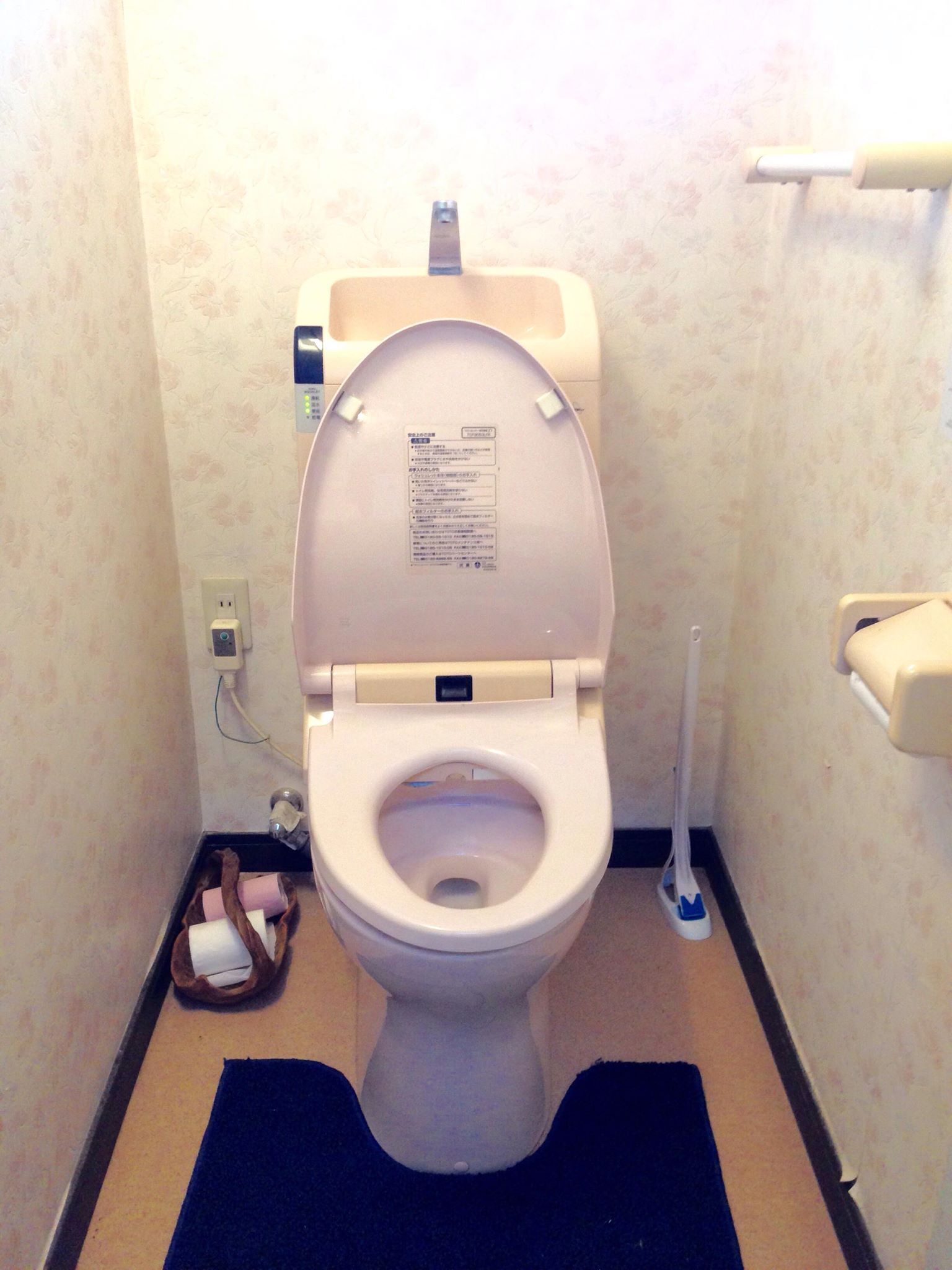 deep-soaking bathtub, rainfall showerhead, hair dryer, slippers