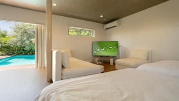 Exclusive Villa, Pool View | Living area | 65-inch LCD TV with digital channels, TV, Netflix