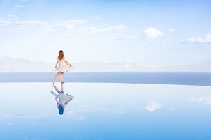Seasonal outdoor pool, open 10:00 AM to 7:00 PM, pool umbrellas