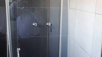 Separate tub and shower, towels, soap, toilet paper