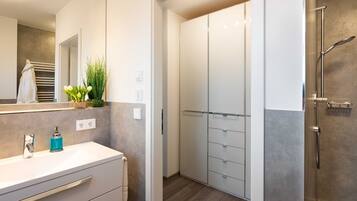 Shower, hair dryer, towels, soap