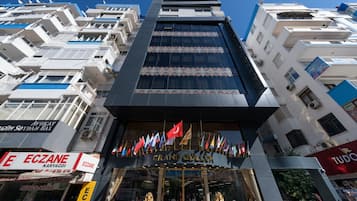 A multi-story building with a prominent entrance labeled "Grand Guluk."