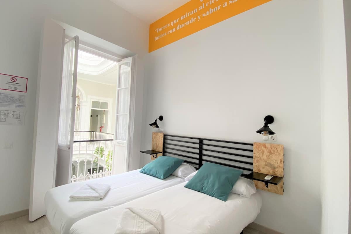 Economy Double or Twin Room, Private Bathroom | Individually decorated, blackout drapes, soundproofing